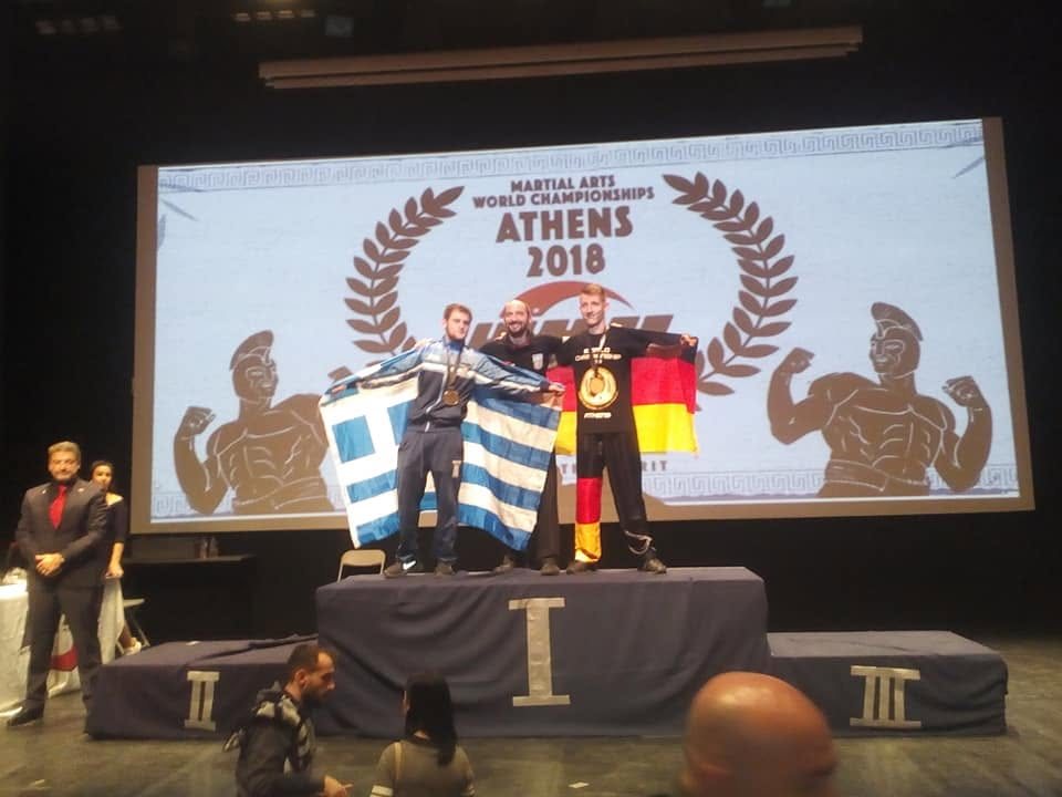Βάθρο νικητών με την ελληνική σημαία στο Martial Arts World Championships, Αθήνα 2018